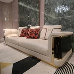Cream Leather Sofa with Dark High-Gloss Wood Panels, Monogram Cushions and Metal Base Trim